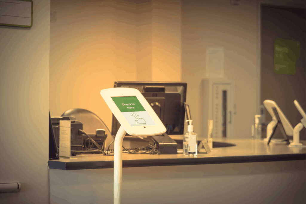 A patient check-in kiosk at the front desk of a medical facility.