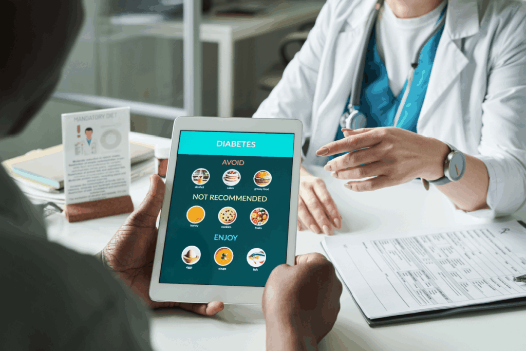 A doctor reviews a digital diabetes management plan on a tablet with her patient in a clinical setting.